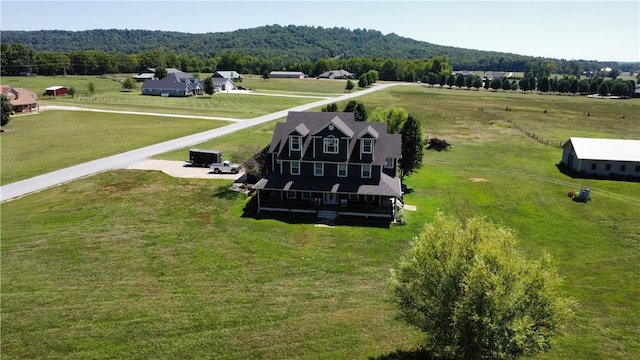 birds eye view of property with a mountain view and a rural view