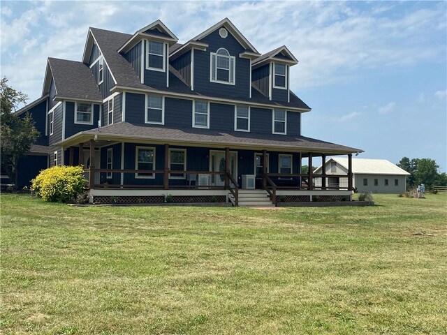 country-style home with a front lawn and covered porch