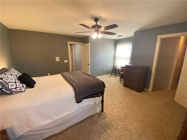 bedroom featuring ceiling fan and light colored carpet