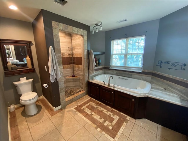 bathroom with independent shower and bath, tile patterned floors, and toilet