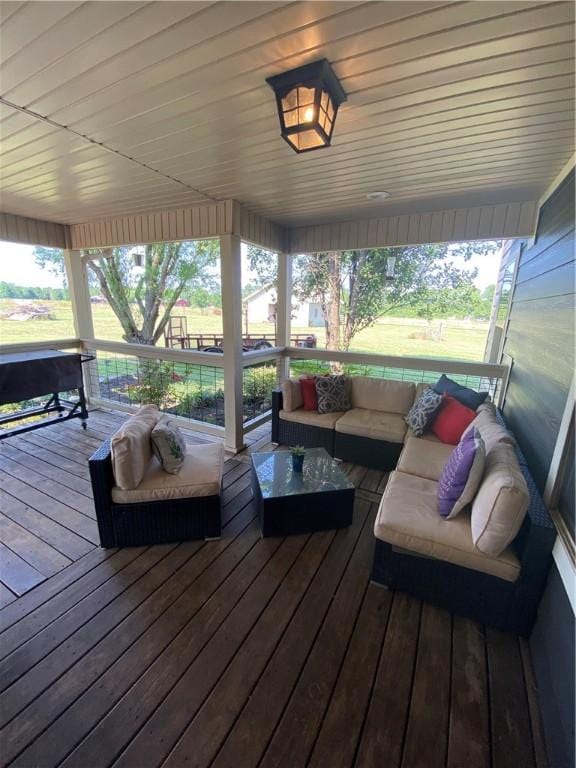 deck featuring outdoor lounge area