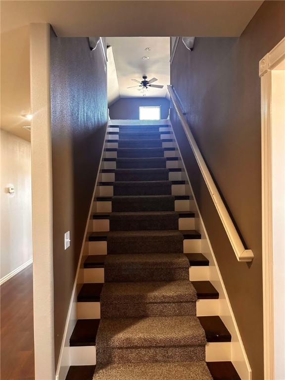 stairs with ceiling fan