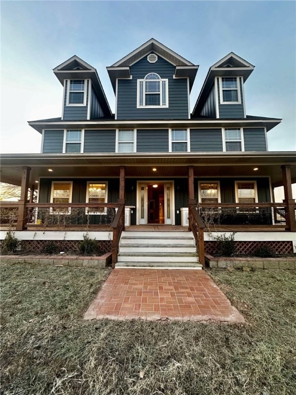 view of front facade with a porch and a front yard