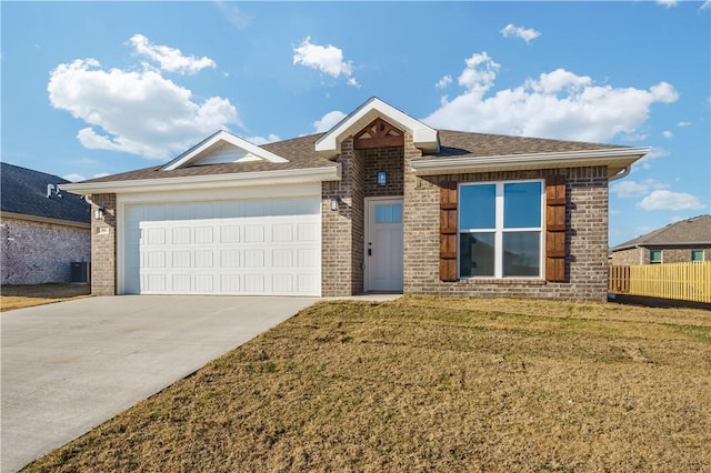 single story home featuring a front lawn and a garage