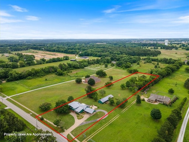 birds eye view of property featuring a rural view