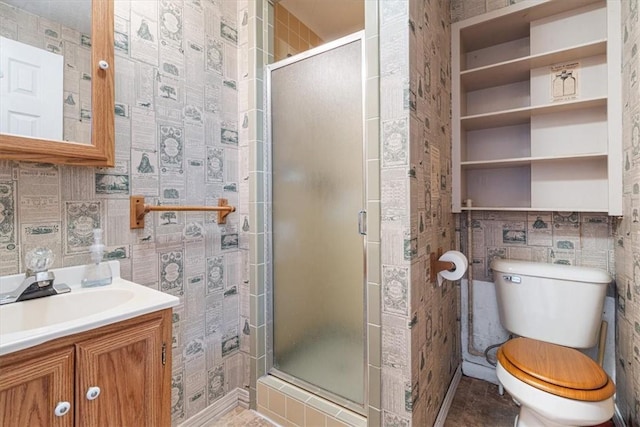 bathroom featuring toilet, a stall shower, and tile walls