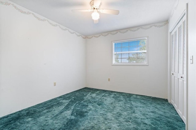 unfurnished bedroom featuring a closet, carpet, and a ceiling fan