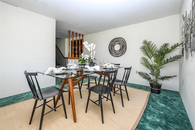 view of carpeted dining space