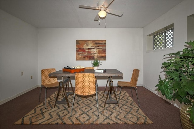 dining area featuring carpet floors, baseboards, and a ceiling fan