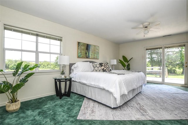 carpeted bedroom featuring access to exterior and baseboards