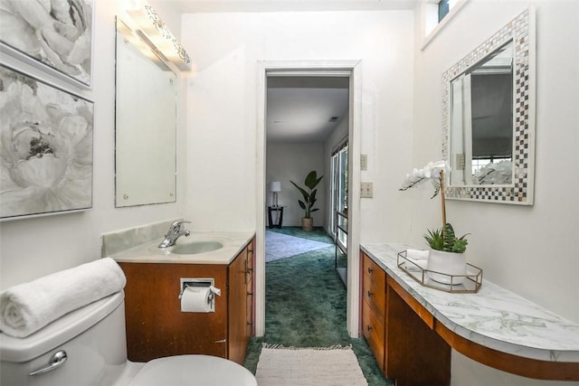 half bath with vanity and toilet