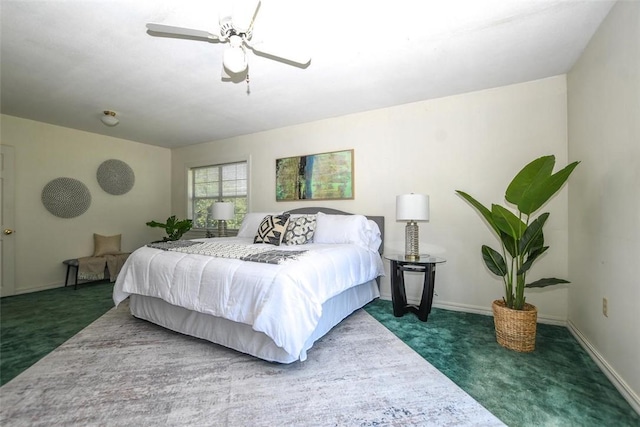 bedroom with carpet, ceiling fan, and baseboards