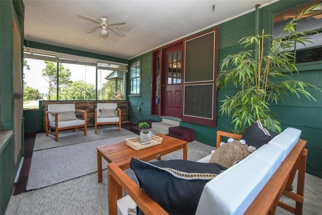 sunroom featuring a ceiling fan