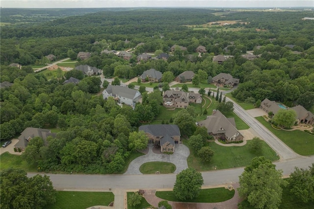 aerial view with a residential view and a view of trees