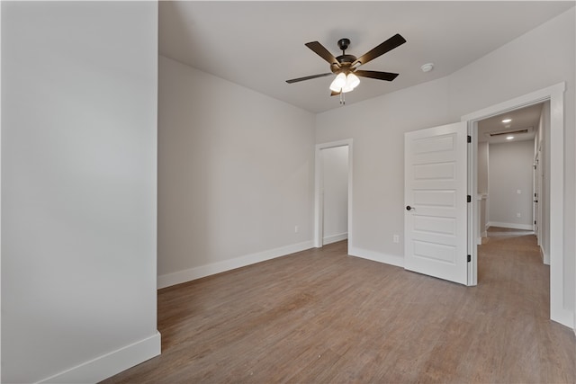 unfurnished bedroom featuring ceiling fan and light hardwood / wood-style flooring