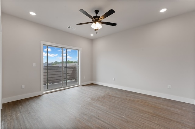 unfurnished room with hardwood / wood-style flooring and ceiling fan