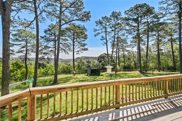 wooden terrace with a yard