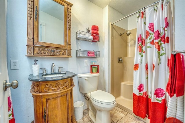 bathroom with tile patterned floors, vanity, toilet, and walk in shower