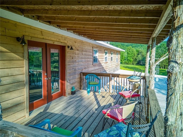 wooden deck featuring french doors