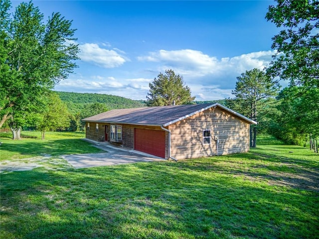 view of outbuilding featuring a lawn