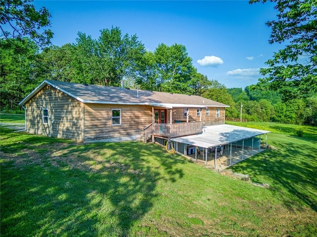 back of house with a wooden deck and a yard