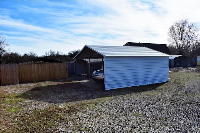 view of outbuilding with a carport