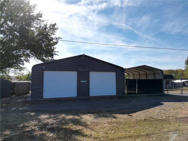 garage featuring a carport