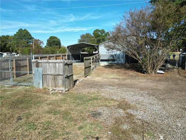 view of yard with a carport