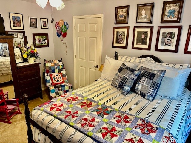 bedroom featuring ceiling fan and carpet floors