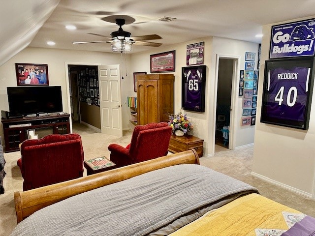 carpeted bedroom with ceiling fan, ensuite bath, and lofted ceiling