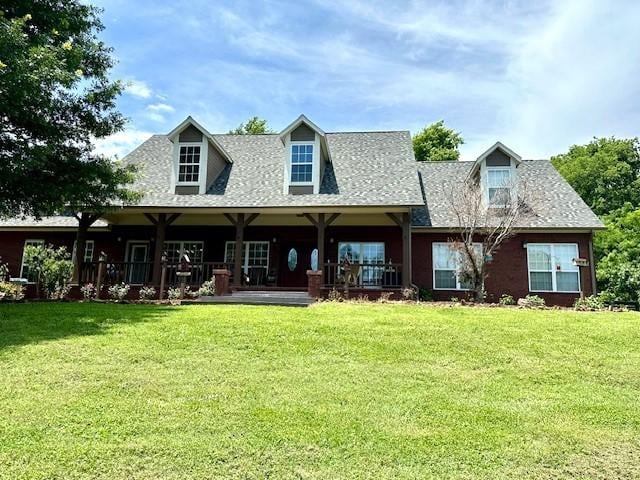 rear view of house with a yard