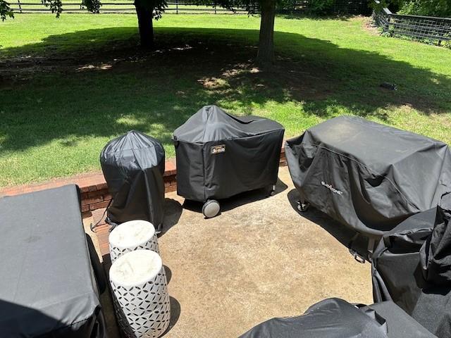 view of yard featuring fence and a patio area