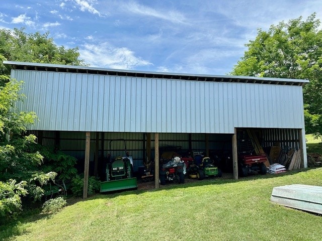 view of outdoor structure with a lawn