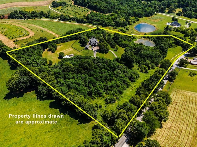 aerial view featuring a rural view and a water view