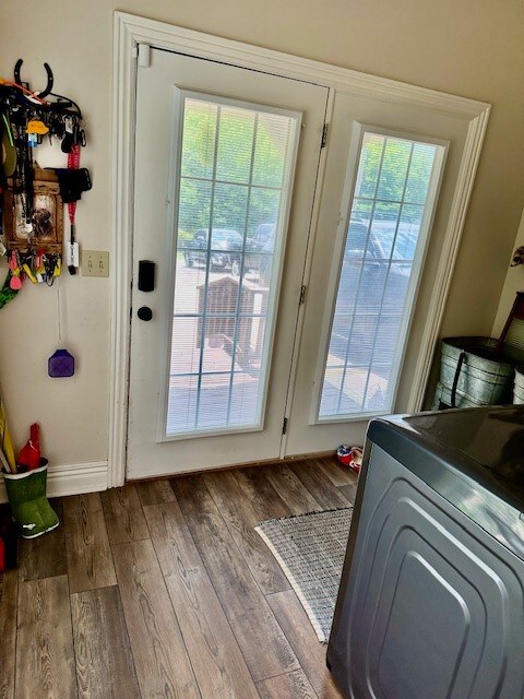 doorway to outside with dark hardwood / wood-style floors