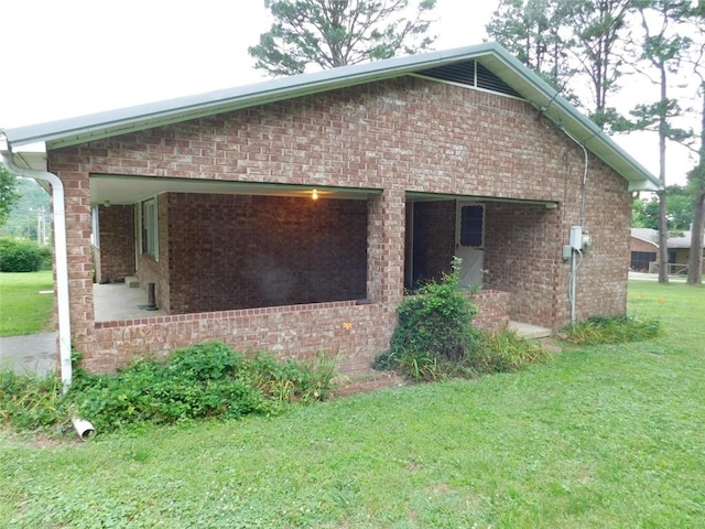 view of home's exterior with a lawn