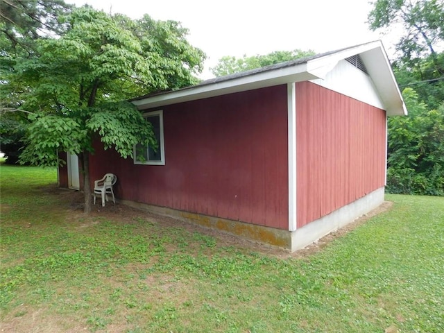 view of outbuilding with a lawn