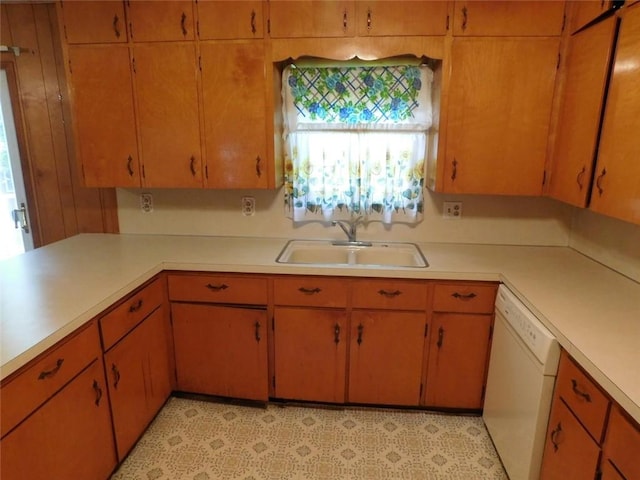 kitchen featuring sink and white dishwasher