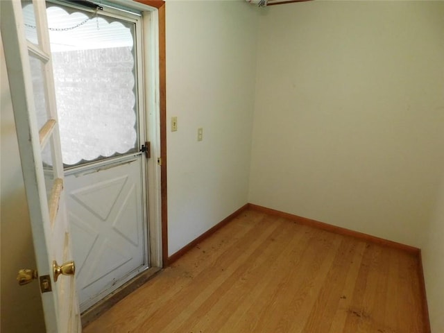 spare room with light hardwood / wood-style floors