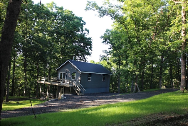 back of house with a wooden deck