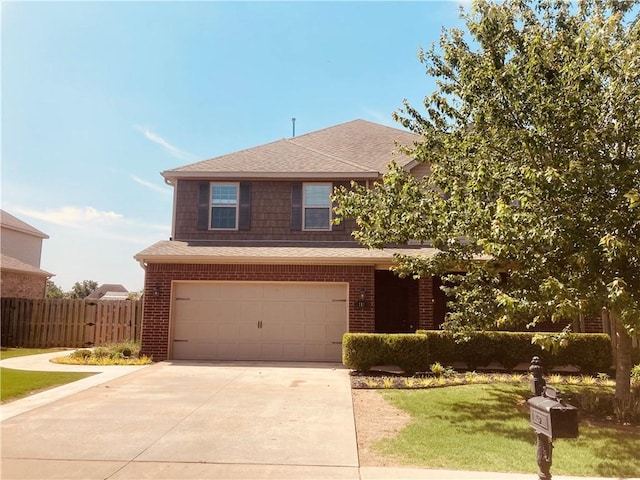 view of front of home featuring driveway, fence, a front yard, a garage, and brick siding