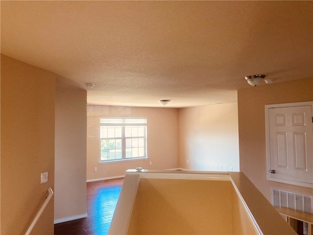 empty room with hardwood / wood-style floors