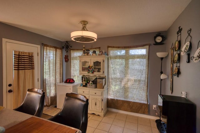 dining room featuring light tile patterned floors