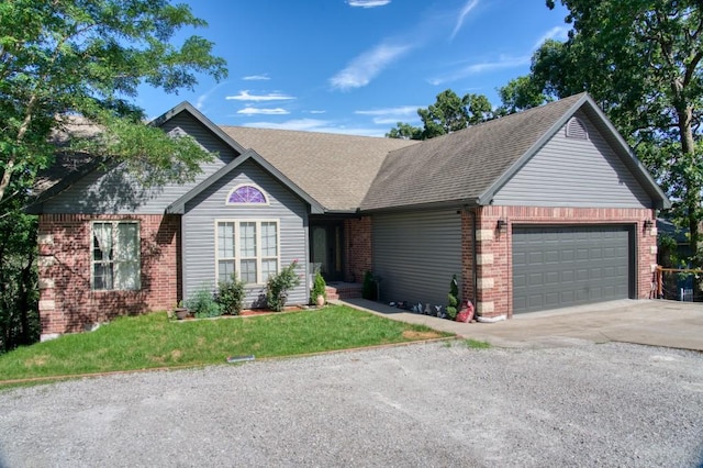 view of front facade featuring a front lawn and a garage