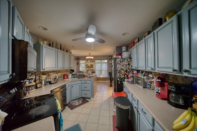 kitchen with ceiling fan, tasteful backsplash, light tile patterned flooring, kitchen peninsula, and stainless steel appliances