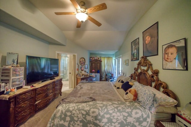 carpeted bedroom with ceiling fan, ensuite bath, a baseboard radiator, and vaulted ceiling