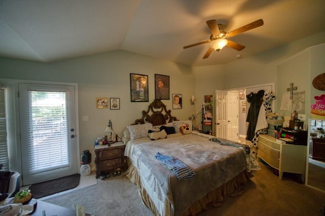 carpeted bedroom with ceiling fan and vaulted ceiling