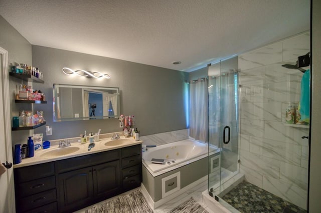 bathroom with vanity, separate shower and tub, and a textured ceiling