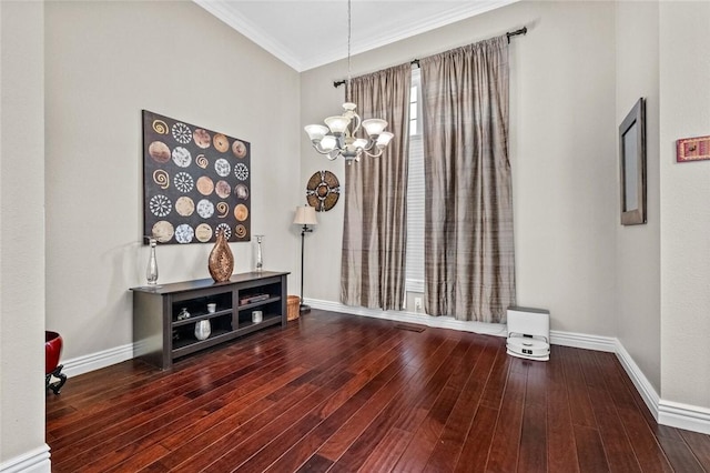 dining area featuring hardwood / wood-style flooring, crown molding, and a chandelier