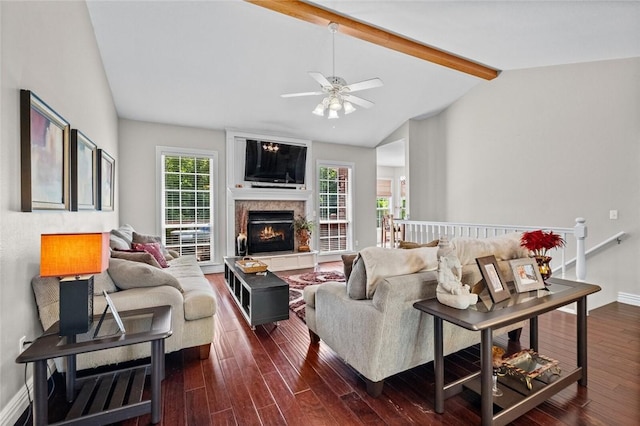 living room featuring ceiling fan, dark hardwood / wood-style flooring, and lofted ceiling with beams